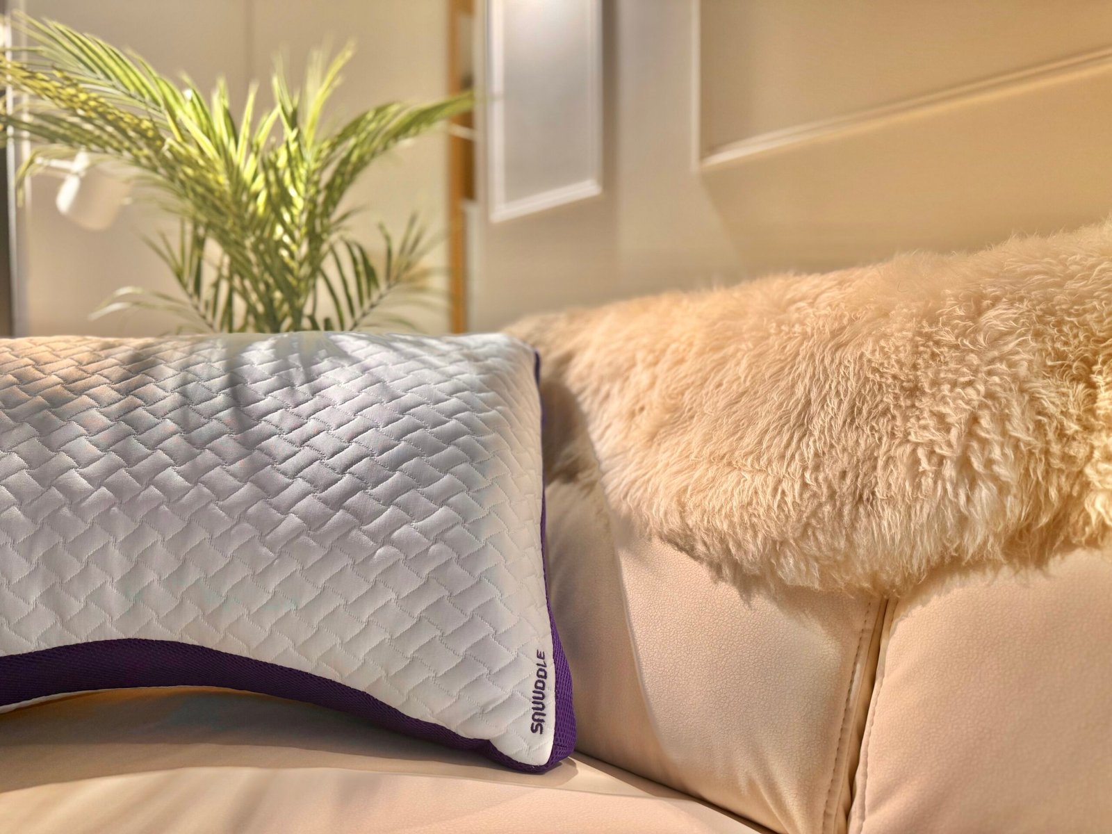 Ergonomic Snuuddle pillow designed for side and back sleepers in Singapore